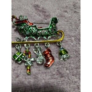 New Santa's Green Sled with Trinkets on bottom Brooch. 1.5ins Long, 1.3ins Wide.